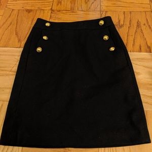 Black shift skirt with gold buttons